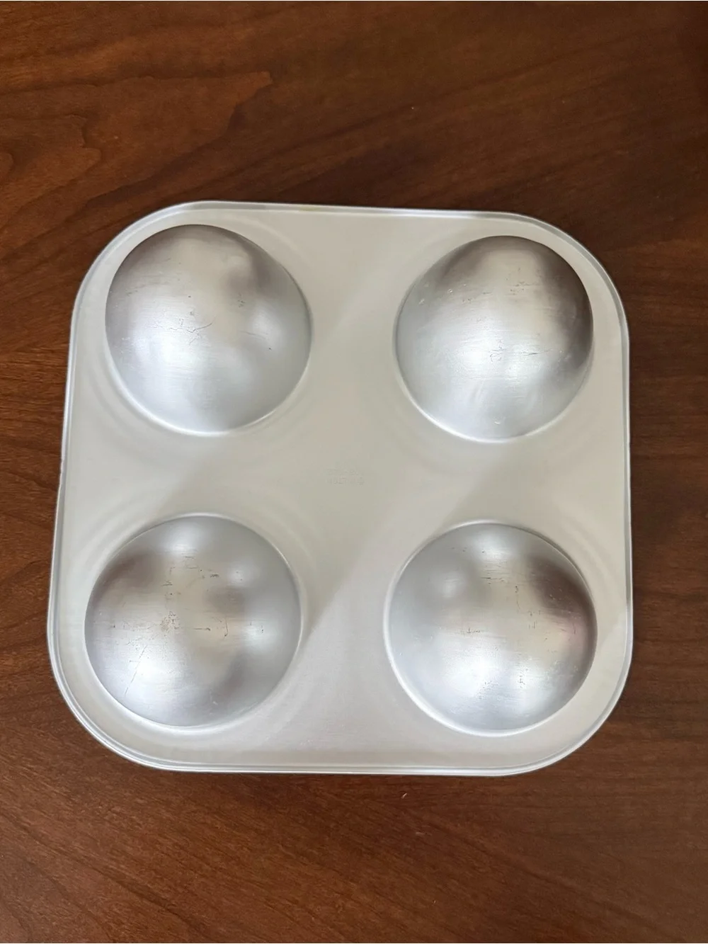 Wilton Cake Pan Wonder Mold (4) Doll Skirts, Easter Eggs, Footballs #508-302